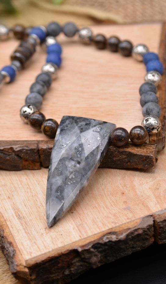 Image of a necklace with shield shaped pendant created from larvikite gemstone and variety of other gemstone beads that include lapis lazuli, larvikite, bronzite, and lava stone. Included in our new mens collection. Makes great gifts for Dad on Father's Day | Emerald Sun Creations - Natural Gemstone Jewelry